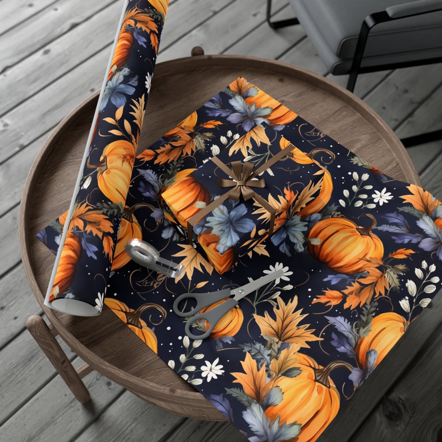 A roll of autumn gift wrap featuring an elegant pumpkin vine design in warm fall colors.