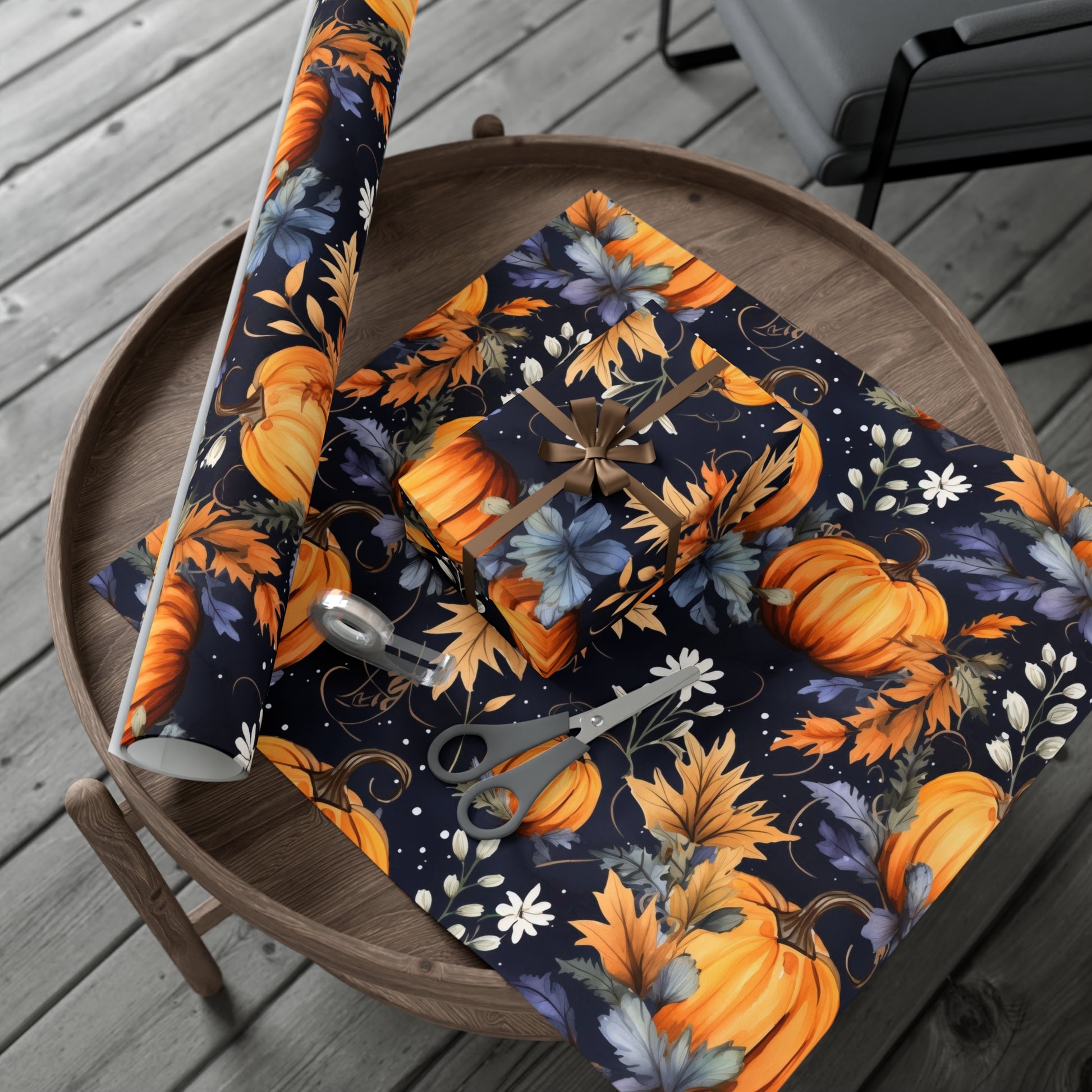 A roll of autumn gift wrap featuring an elegant pumpkin vine design in warm fall colors.