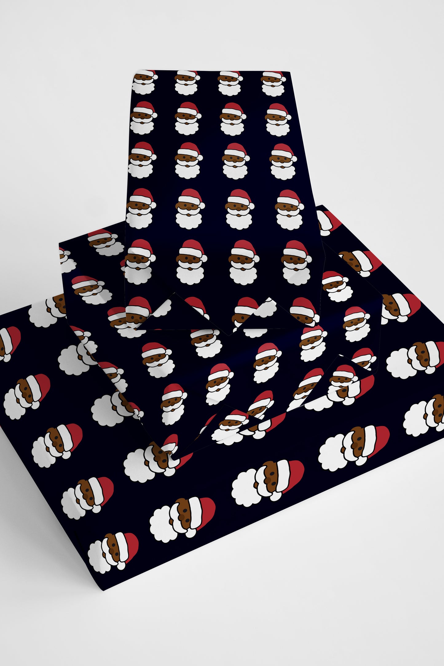 Modern and fun emoji Santa wrapping paper, perfect for adding a cheerful, lighthearted touch to holiday gifts.