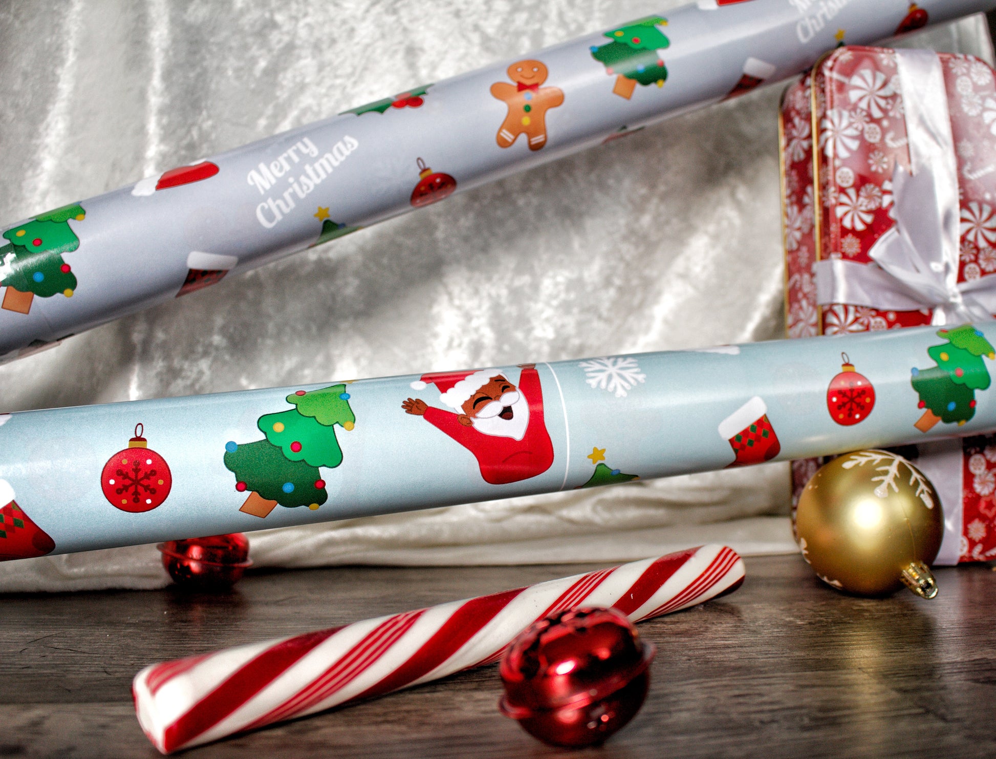 A roll of festive holiday wrapping paper with a playful frosted gingerbread man pattern.