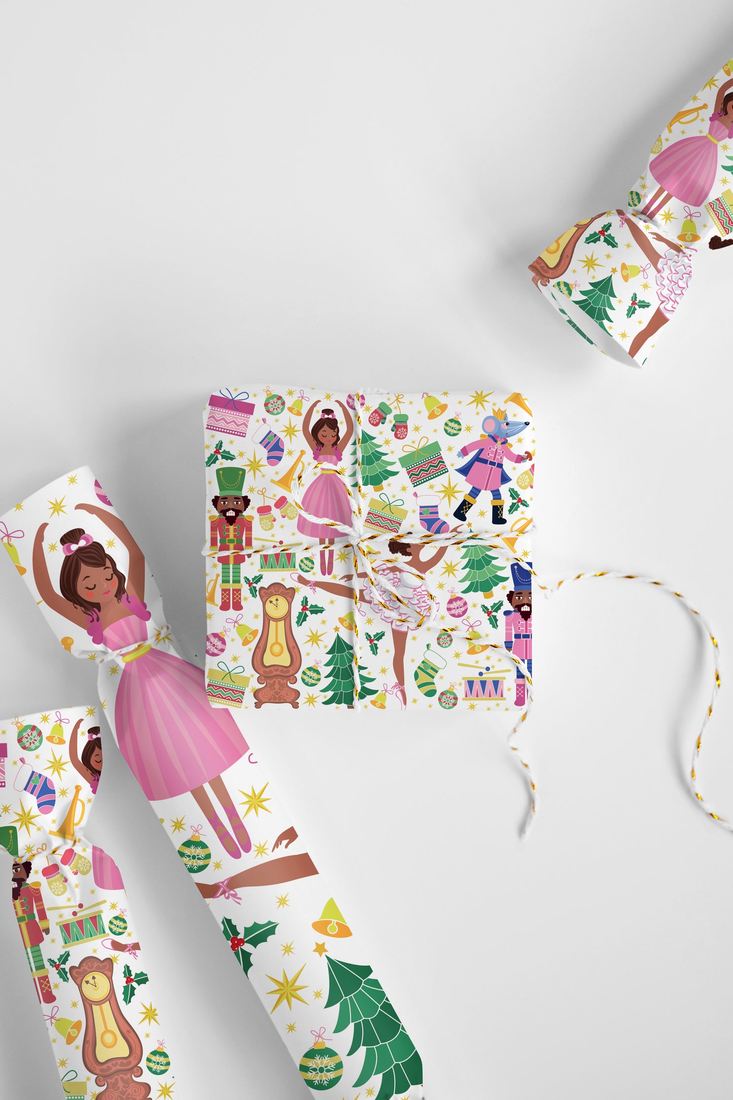 Whimsical ballerina and nutcracker pattern gift wrap in chocolate brown for festive season gifts.
