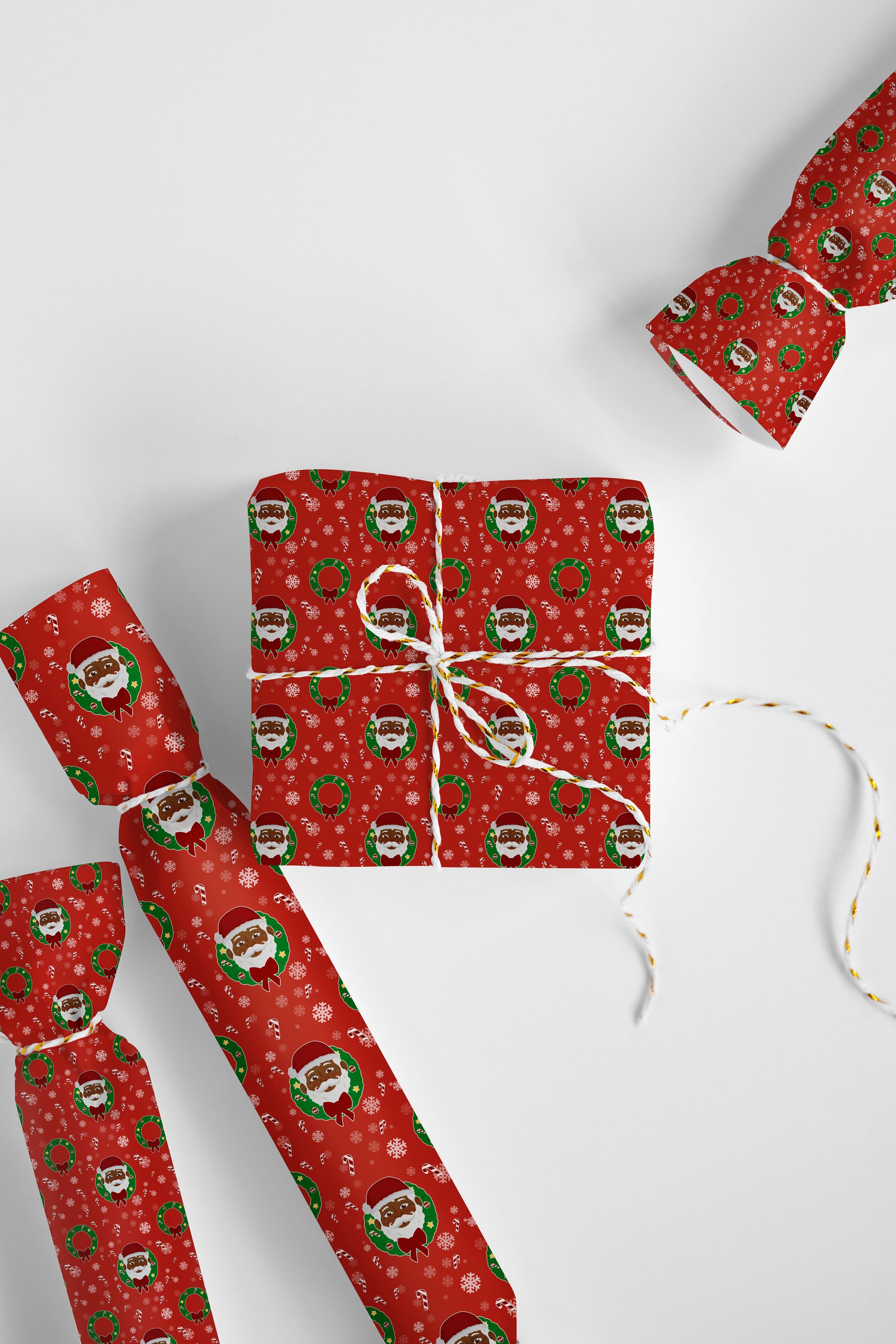 Festive gift wrap with a unifying wreath and Black Santa design, perfect for holiday presents and cultural celebration.