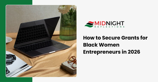 A high-end professional desk with a laptop, a gold pen, and a coffee mug, representing the grant application process.