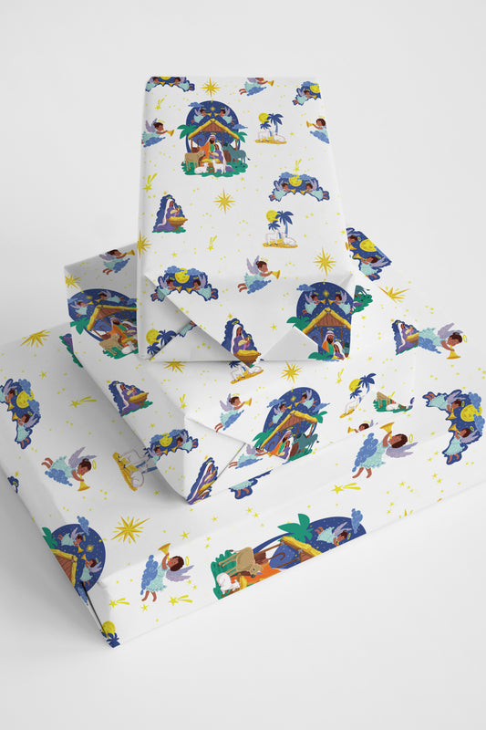 Winter holiday wrapping paper featuring a classic illustrated village in a snowy landscape.